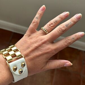 Gold and white leather bracelet with gold chain coach ring